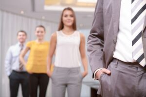 Trade show staff dressed professionally in brand colors