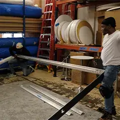 Staff preparing custom booth components
